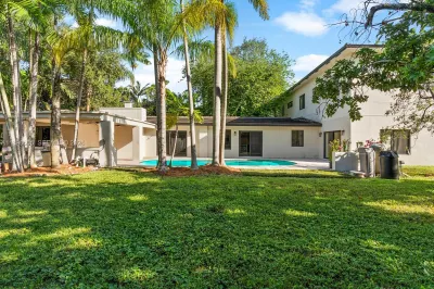 Set on a full acre of lush, tree-filled land, this