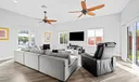 Family room with 10 foot ceiling height and two sets of sliding doors - one to the pool and one to the yard.