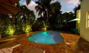 Sip cocktails pool side while enjoying the romantic sunset among friends and family