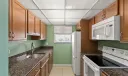 Social room with kitchen, showers and restrooms. Located off of the pool area.
