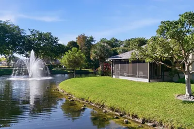 Tranquil lakefront living with a gentle fountain b