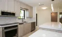 Stunning kitchen with elongated quartz island