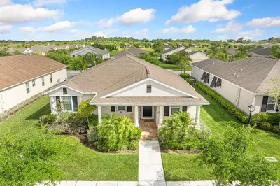 Aerial View front exterior with a spacious porch,