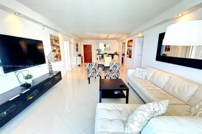 white leather sect sofa, Large Flat TV, upscale fu