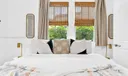 Primary king bedroom with newly updated designer en-suite bathroom.