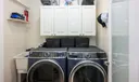Laundry off kitchen leads to garage with "slop" sink