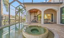 Relax in the spa surrounded by beautiful pavers