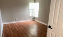 Second bedroom has new laminate flooring and new vertical blinds