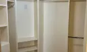 Primary Bedroom custom closet with built in drawers.