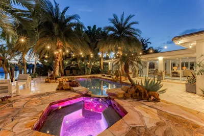Outdoor oasis with hot tub, heated pool and tiki b