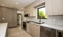 Stunning kitchen with elongated quartz island