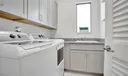 Large Laundry room with plenty of storage