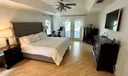 Primary Bedroom with french doors to pool deck