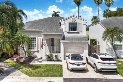 Exterior of the home shows the one car garage with