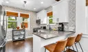 Discover a newly updated kitchen featuring sleek stainless steel appliances and dining service for 10. Enjoy the convenience of both Keurig and filter coffee options in this fully equipped culinary space.