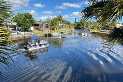 VIEW OF PONTOON BOATS PASSING BY
