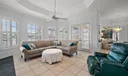 Family Room with Gas fireplace and plantation shuttered windows