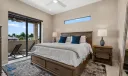 In-law suite bedroom with access to full bathroom and balcony. Also includes a walk-in closet.