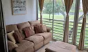 Back Patio Enclosed Overlooking Golf Course And Water