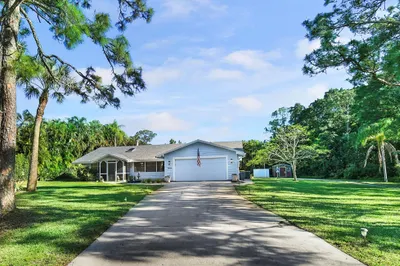 Front of Home with Long Drive and 2 car garage