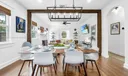 Enjoy a mid-century dining experience under an elegant chandelier, featuring a table for s6, 3 bar stools, and an outdoor set for 6 Classic elegance meets modern comfort.