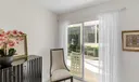 Access the sunroom from the living room or the primary bedroom