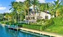 Discover a Paradise Surrounded by Palm Trees and Water Views!