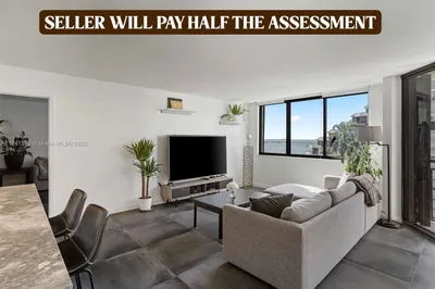 The spacious living area seamlessly connects to a