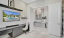 Den/Office with Custom Built In Desk & Double Doors