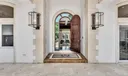 The large sconces that create a masterul entrance