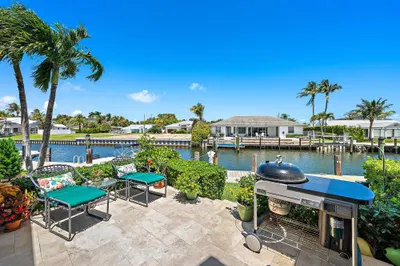 Back patio with panoramic water views steps from f