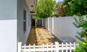 Side of house perfect for dog run or garden