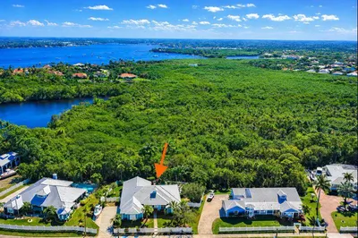 Custom home on one-half acre that backs to expansi