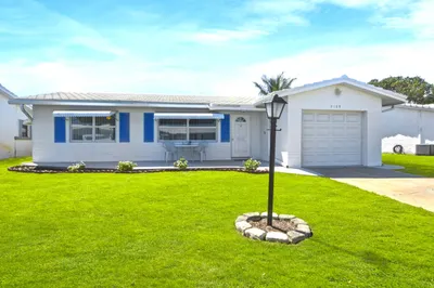 Edgewood Model with concrete driveway and front po