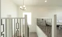 Staircase leading to the second floor and loft area