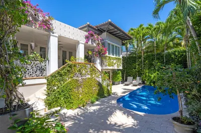 A private backyard pool surrounded by an exquisite