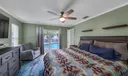 Primary bedroom overlooking pool/patio