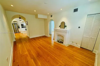 Beautiful wood floors & recessed lighting through