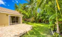 Patio overlooking tropical garden space
