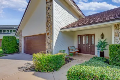 Stone facade accents, durable tile roofing, wood-p