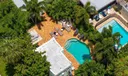 Aerial views of this exquisite villa with private guest house, pool and outdoor amenities to enjoy with family & friends.