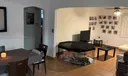 Dinin- Living area showing small hallway entry to Downstairs Bedroom