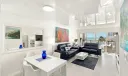 Dining and living area with expansive Southeast Shoreline views.