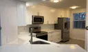 9055 Wiles Rd #307 Photo
