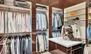 Expansive "his" custom closet