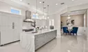 Sub Zero Refrigerator with matching cabinet fronts