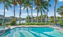 Waterfront Oasis with Lush Palm Trees and a Sparkling Pool - Your Dream Escape Awaits!