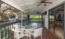 Screened outdoor dining at the Clubhouse